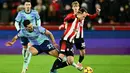 DI babak kedua, Arsenal langsung tancap gas. Pada menit ke-50, Mikel Merino berhasil melesakkan bola ke gawang Brentford. Arsenal unggul 2-1 atas Brentford. (JUSTIN TALLIS/AFP)
