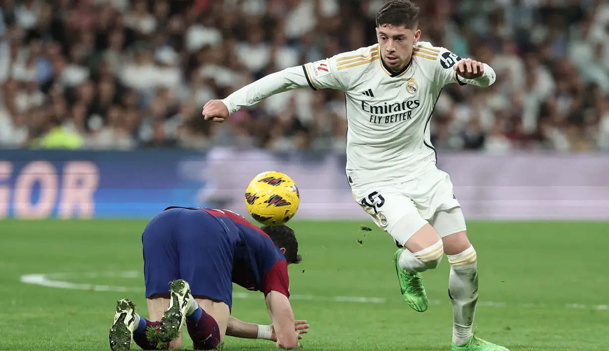 <p>Dengan kemenangan ini, Real Madrid semakin kokoh di puncak klasemen dengan raihan 81 poin. (Thomas COEX / AFP)</p>