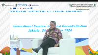 Direktur Jenderal Perimbangan Keuangan Kementerian Keuangan, Luky Alfirman dalam Seminar Internasional Desentralisasi Fiskal 2024 Selasa, (24/9/2024). (Foto: Liputan6.com/Tira Santia)