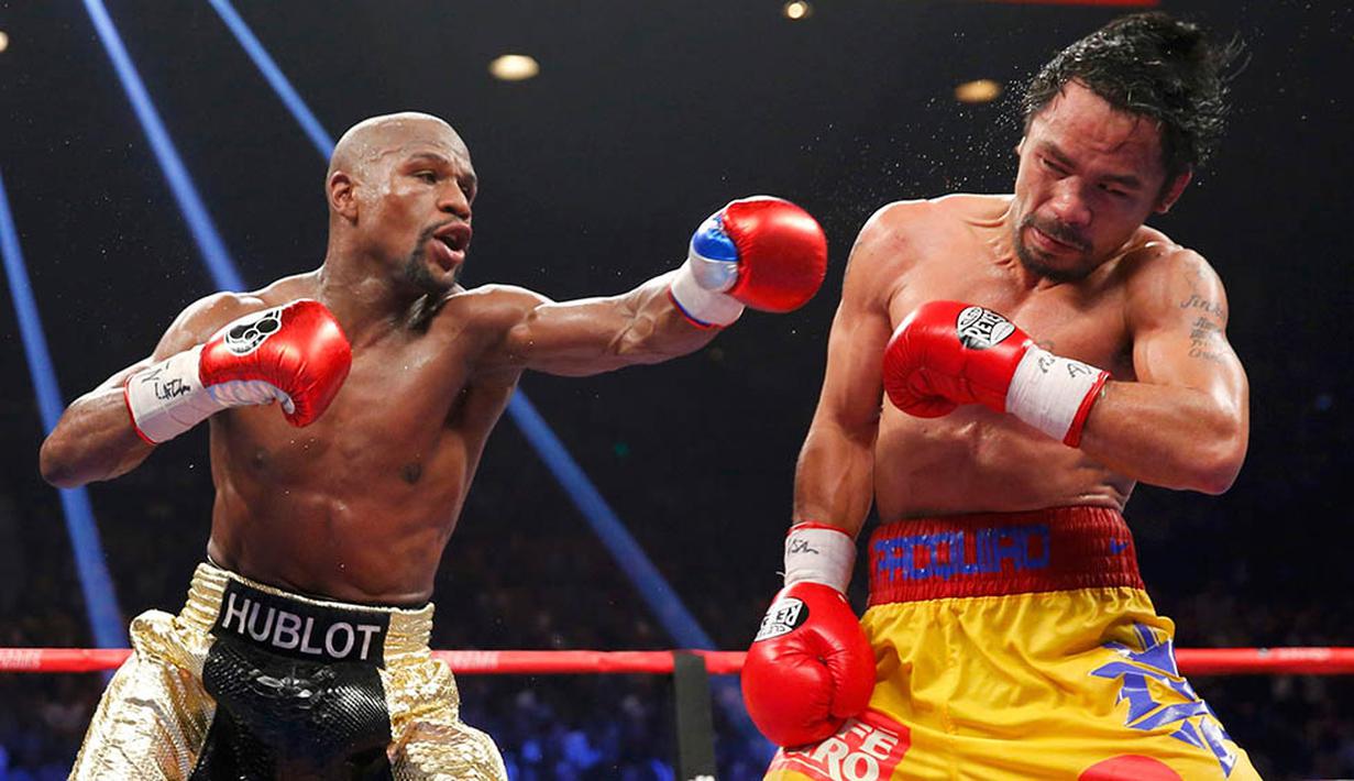 1. Floyd Mayweather Jr. berhasil menjadi juara dunia kelas welter versi WBO usai mengalahkan Manny Pacquiao pada laga bertajuk pertarungan abad ini. (Reuters/Steve Marcus)