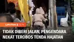 Pengendara sepeda motor menerobos tenda hajatan yang digelar seorang warga di kawasan Kembangan, Jakarta Barat, karena menutup semua badan jalan.