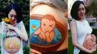 Seorang seniman hamil asal Tiongkok menggunakan perut buncitnya sebagai medium lukis.