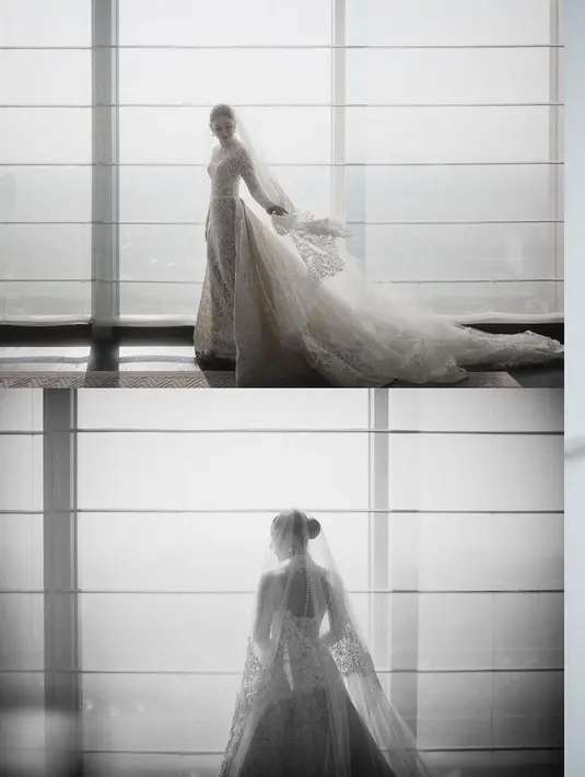 Gaun pengantin klasik Jessica Mila dilengkapi dengan train serta veil yang sama panjangnya. Membuat kesan dramatis dan sakral yang menjadi satu. [Foto: Instagram @thebridestory]