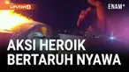 Sebuah aksi heroik terekam saat seorang wanita yang terjebak di dalam mobil yang terbakar berhasil diselamatkan oleh seorang polisi di Phoenix, Arizona.