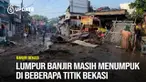 Sepekan lebih pasca banjir besar, sejumlah titik di Kota Bekasi, Jawa Barat, masih menunjukkan dampak yang cukup signifikan, dengan sisa lumpur yang masih terlihat di beberapa lokasi terdampak.