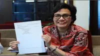 Direktur Pelaksana Bank Dunia, Sri Mulyani melaporkan surat pemberitahuan (SPT) 2013 PPh Orang Pribadi di Kantor Pusat Ditjen Pajak.