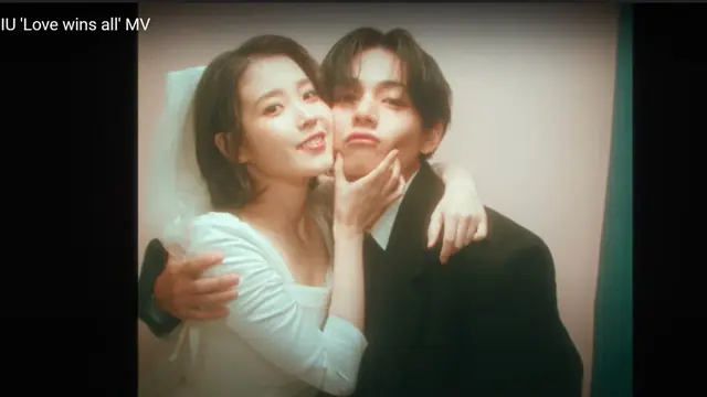 Penyanyi asal Korea Selatan IU merilis video klip terbaru Love Wins All. Ia menggandeng V BTS dalam video klip itu. (tangkapan layar/Youtube IU official)