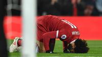 Gelandang Liverpool Mohamed Salah merayakan gol pertamanya saat melawan Newcastle United dalam pertandingan Liga Inggris di Anfield, Liverpool (3/3). Dalam pertandingan ini Liverpool menang 2-0 atas Newcastle. (Anthony Devlin / PA via AP)