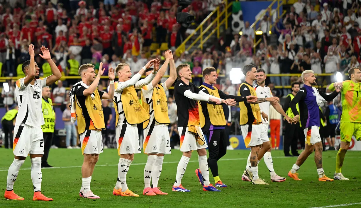 Jerman memastikan lolos ke babak berikutnya usai menang 2-0 atas Denmark. (INA FASSBENDER/AFP)