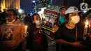 Sejumlah massa aksi yang tergabung dalam Tim Advokat Penegak Hukum dan Keadilan (Tampak) menggelar aksi 1000 lilin atas kematian Brigadir Yosua Hutabarat atau Brigadir J di Bundaran HI, Jakarta, Jumat (22/7/2022). Aksi tersebut sebagai bentuk keadilan terkait kematian Brigadir J yang diduga akibat penyiksaan. (Liputan6.com/Faizal Fanani)