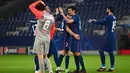 Pemain Atletico Madrid merayakan kemenangan atas RB Salzburg pada laga lanjutan Grup A Liga Champions di Red Bull Arena, Kamis (10/12/2020) dini hari WIB. Atletico Madrid menang 2-0 atas RB Salzburg. (AFP/Joe Klamar)