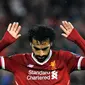 Pemain Liverpool, Mohamed Salah usai mencetak gol ke gawang AS Roma pada leg pertama semifinal Liga Champions di Stadion Anfield, Liverpool, Inggris, Selasa (24/4). Salah tak melakukan selebrasi usai membobol gawang mantan klubnya. (AP Photo/Rui Vieira)