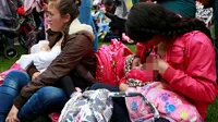 Para ibu saat menyusui bayi mereka selama memperingati Pekan ASI Dunia di Bogota, Kolombia (3/8). Aksi ini untuk mengkampanyekan pentingnya manfaat Air Susu Ibu (ASI) untuk kesehatan bayi dan balita. (REUTERS/John Vizcaino)