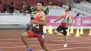 Purnomo Sapto Yogo pelari Indonesia meraih medali emas di nomor 100 meter putra klasifikasi T37 pada Asian Para Games 2018, di Stadion Utama Gelora Bung Karno Jakarta, Selasa (9/10/2018).  (Bola.com/Peksi Cahyo)