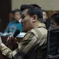 Terpidana korupsi e-KTP, Andi Agustinus alias Andi Narogong saat menjadi saksi pada sidang lanjutan dugaan korupsi pengadaan E-KTP dengan terdakwa Anang S Sudihardjo di Pengadlian Tipikor, Jakarta, Kamis (12/4). (Liputan6.com/Helmi Fithriansyah)