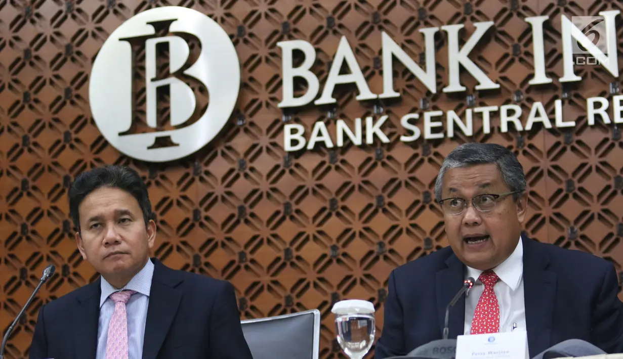Gubernur BI Perry Warjiyo memberikan penjelasan kepada wartawan di Jakarta, Kamis (20/6/2019). RDG Bank Indonesia 19-20 Juni 2019 memutuskan untuk mempertahankan BI7DRR sebesar 6,00%, suku bunga Deposit Facility sebesar 5,25%, dan suku bunga Lending Facility sebesar 6,75%.(Liputan6.com/Angga Yuniar)