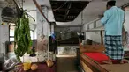 Seorang pria melaksanakan salat di atas lapak yang kosong di Pasar Blora, Jakarta, Kamis (17/12/2015). Rencananya Pemprov DKI akan membongkar pasar yang telah berdiri sejak 1971 itu untuk dijadikan Terminal Terpadu Dukuh Atas. (Liputan6.com/Yoppy Renato)