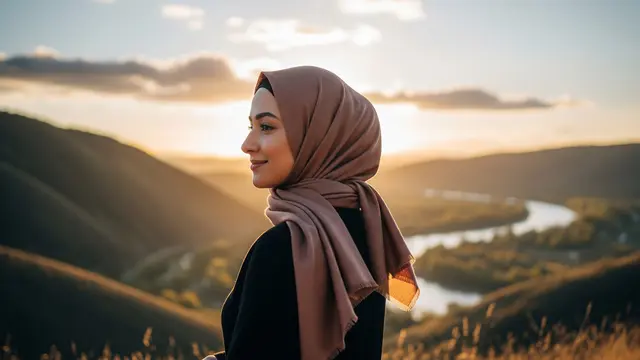 Styling hijab Lebaran yang cocok untuk wajah bulat agar terlihat tirus di foto/Gemini AI