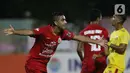 Pemain belakang Persija, Otavio Dutra merayakan gol yang dicetaknya ke gawang Bhayangkara FC pada lanjutan Shopee Liga 1 Indonesia di Stadion PTIK, Jakarta, Sabtu (14/3/2020). Laga kedua tim berakhir imbang 2-2. (Liputan6.com/Helmi Fithriansyah)