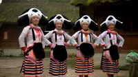 Wanita suku Miao gunakan konde dari rambut ratusan tahun sebagai bentuk tradisi nenek moyang. (Foto: Dailymail)