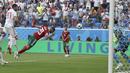 Pemain Moroko, Aziz Bouhaddouz (20) melakukan gol bunuh diri saat melawan Iran pada laga grup B Piala Dunia 2018 di St. Petersburg Stadium, Rusia, (15/6/2018). Iran menang 1-0. (AP/Themba Hadebe)