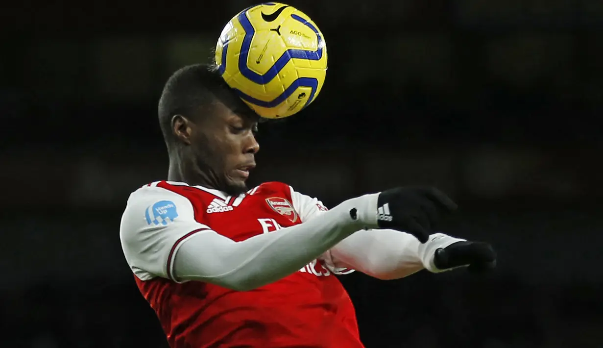 Nicolas Pepe. Sayap kanan Pantai Gading berusia 27 tahun ini baru saja bergabung dengan OGC Nice di awal musim 2022/2023 dengan status pinjaman dari Arsenal. Arsenal sendiri mendatangkannya dari LOSC Lille dengan nilai transfer 80 juta euro atau kini setara Rp1,2 triliun pada awal musim 2019/2020, saat Unai Emery menjalani musim keduanya bersama The Gunners. (AFP/Ian Kington)