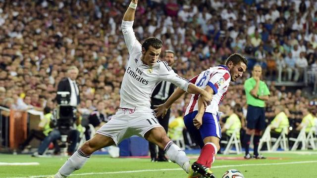 Gareth Bale (Real Madrid) dan Koke (Atletico Madrid)