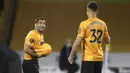 Pemain Wolverhampton Wanderers Castro Otto (kiri) melakukan selebrasi usai mencetak gol ke gawang Crystal Palace pada pertandingan Premier League di Molineux Stadium, Wolverhampton, Inggris, Senin (20/7/2020). Wolverhampton Wanderers menang 2-0. (AP Photo/Martin Rickett, Pool)