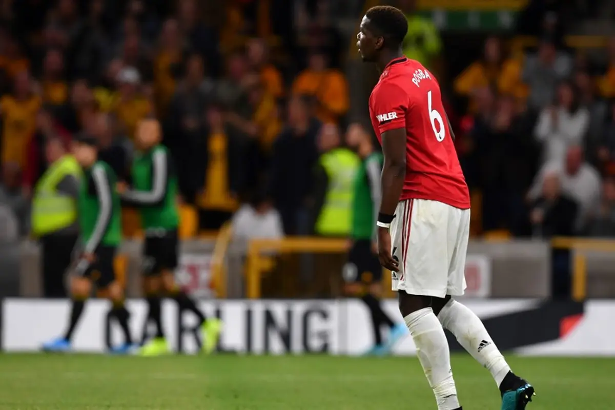 Gelandang Manchester United (MU), Paul Pogba (PAUL ELLIS / AFP)