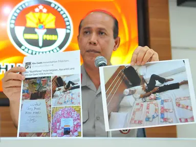 Kadiv Humas Mabes Polri, Irjen Boy Rafli Amar menunjukan foto pelaku penyebar isu Rush Money di Mabes Polri, Jakarta, Sabtu (26/11). Polisi telah menangkap penyebar ajakan untuk melakukan rush money melalui media sosial. (Liputan6.com/Angga Yuniar)