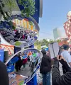 AQUA menghadirkan Teras Adem sebagai pusat pengalaman “Perayaan AQUA Ademin Indonesia” 15–22 Agustus 2026 dalam rangka HUT RI ke-81 di kawasan Blok M, Jakarta (15/8/2026). (Liputan6.com/Alfareza Ramadhani)
