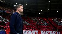 Pelatih Leipzig, Julian Nagelsmann saat menemani skuatnya di pentas Liga Champions, Rabu (2/10/2019).  (AFP / Ronny Hartmann)