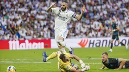 Real Madrid menjaga kansnya dalam perburuan gelar Liga Spanyol setelah menang 4-2 atas Almeria dalam lanjutan pekan ke-32. (AP Photo/Pablo Garcia)