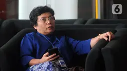 Pimpinan KPK terpilih Lili Pintauli Siregar saat mendatangi Gedung KPK, Jakarta, Selasa (19/11/2019). Lili Pintauli Siregar akan bertemu dengan pimpinan KPK lama untuk berdiskusi tentang pemberantasan korupsi. (merdeka.com/Dwi Narwoko)