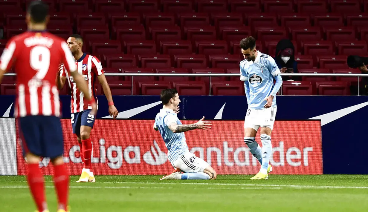 Kemenangan di depan mata Atletico Madrid buyar menyusul gol telat Celta Vigo di menit akhir babak kedua melalui Facundo Ferreyra. (AP Photo/Jose Breton)