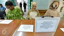 Aktivis Koalisi Anti Mafia Hutan saat melakukan aksi  di Gedung Komisi Yudisial (KY), Jakarta, Jumat (8/1). kedatangan mereka ke KY juga untuk melaporkan dugaan pelanggaran etik Hakim PN Palembang Parlas Nababan. (Liputan6/JohanTallo)