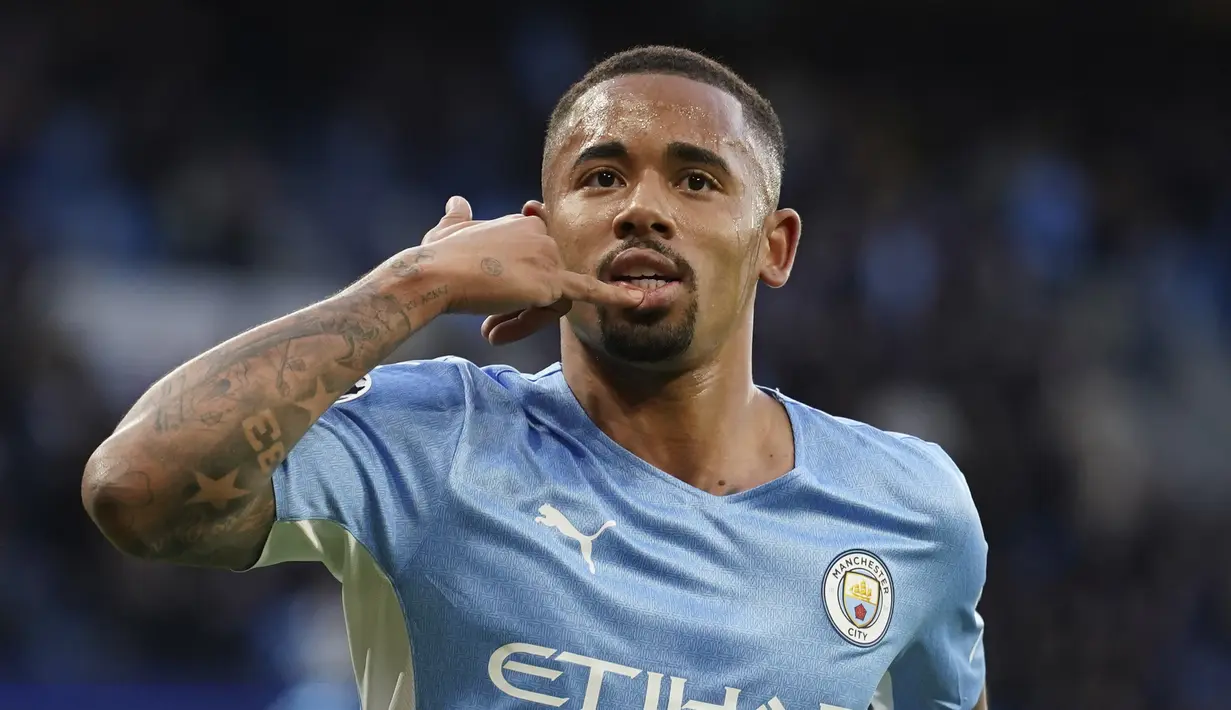 <p>Penyerang Manchester City, Gabriel Jesus melakukan selebrasi setelah mencetak gol ke gawang Real Madrid pada pertandingan leg pertama semifinal Liga Champions di stadion Etihad di Manchester, Inggris, Rabu (27/4/2022). City menang atas Madrid 4-3. (AP Photo/Dave Thompson)</p>