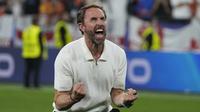 Gareth Southgate menjadi sosok yang paling bahagia setelah berhasil membawa timnya ke Final Euro 2024. (AP Photo/Thanassis Stavrakis)