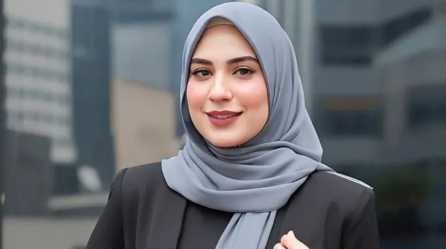 Dress Hitam Blazer Style dengan Hijab Abu-abu Tua. Foto: Meta AI