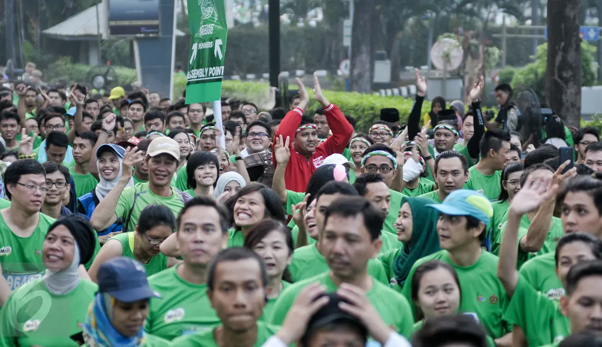 15 ribu pelari dari dalam maupun luar negeri meramaikan  lomba lari 'Milo Jakarta International 10K' di kawasan Kuningan, Jakarta, Minggu (24/7). Lomba lari itu digelar untuk memperingati hari ulang tahun DKI Jakarta ke-489. (Liputan6.com/Yoppy Renato)