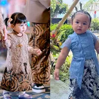 Ameena tampil menggemaskan dengan kebaya brokat warna nude dan kain batik coklat. [@attahalilintar]