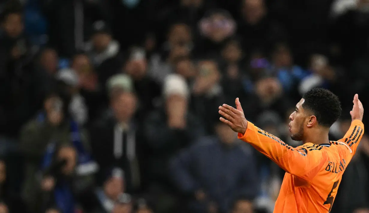 Pada masa tambahan waktu (90+2), Jude Bellingham mencetak gol kemenangan Real Madrid atas Manchester City. Skor 3-2 tidak berubah hingga peluit akhir pertandingan dibunyikan. (Oli SCARFF/AFP)