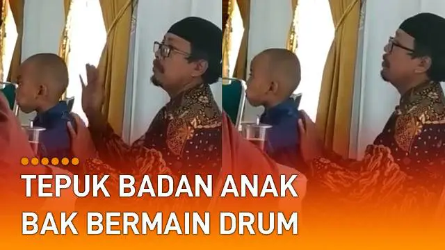 Ia tampak menepuk badan dan kepala anaknya, bergaya mengikuti irama drum.