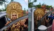 Susahnya pengantin masuk ke dalam mobil dengan riasan lengkap (Sumber: Twitter/aewin86)