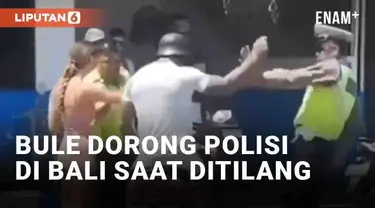 Aksi meresahkan oknum bule di Bali kembali terjadi. Kamera warga merekam pasangan bule bermotor ditilang polisi. Bule pria tiba-tiba mendorong polisi yang mencoba menertibkan.