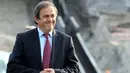 UEFA president Michel Platini smiles as he examines a construction site during a visit on rebuilding Kiev's stadium Olympiysky on April 15, 2009. AFP PHOTO/ SERGEI SUPINSKY 