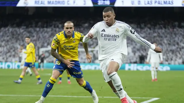 Aksi Kylian Mbappe di laga Real Madrid vs Las Palmas di Santiago Bernabeu, Minggu (19/01/2025). (c) AP Photo/Bernat Armangue