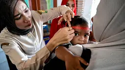 Layanan Posyandu Jaga Kesehatan Balita di Aceh