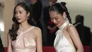 <p>Krystal Jung berperan sebagai Han Yu Rim sementara Jeon Yeo Bin sebagai Shin Mi Do. Dalam Festival Film Cannes 2023 keduanya tampak cantik memukau dengan blackless dress. (Foto: Scott Garfitt/Invision/AP)</p>