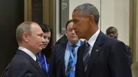 Tatapan Sinis Obama ke Putin (Reuters)